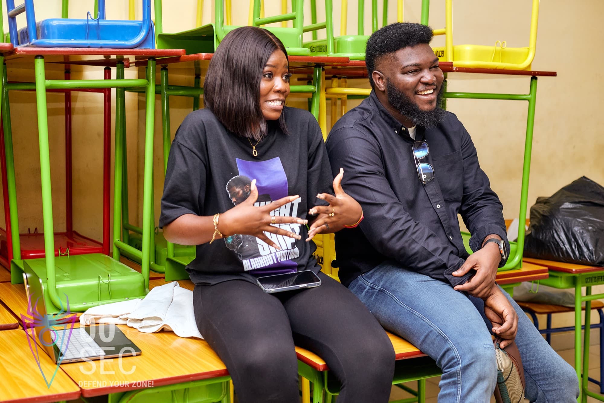 Two NESTCON community members sharing a laugh at the event.