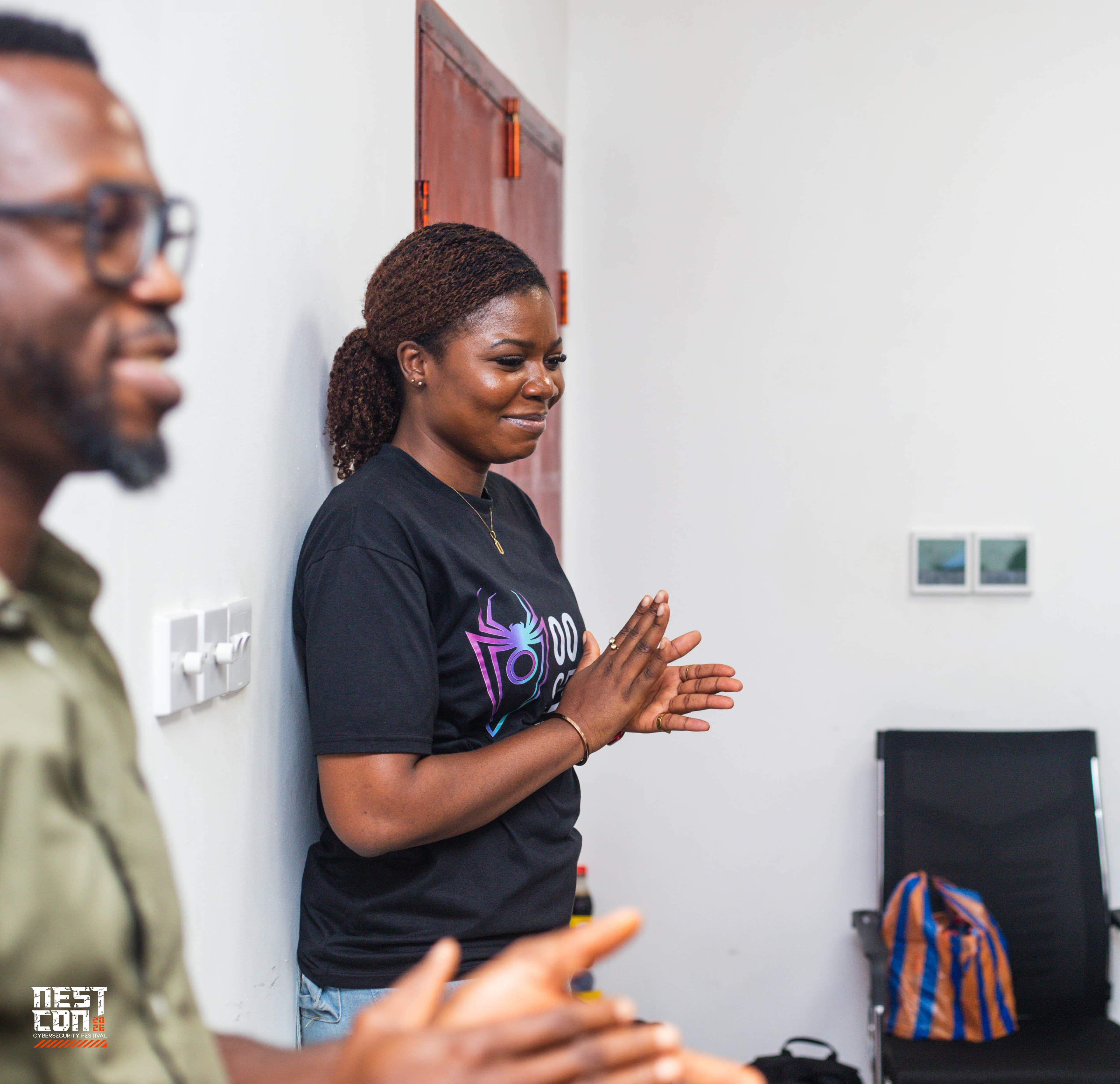 Attendees share a laugh during an informal moment between sessions.