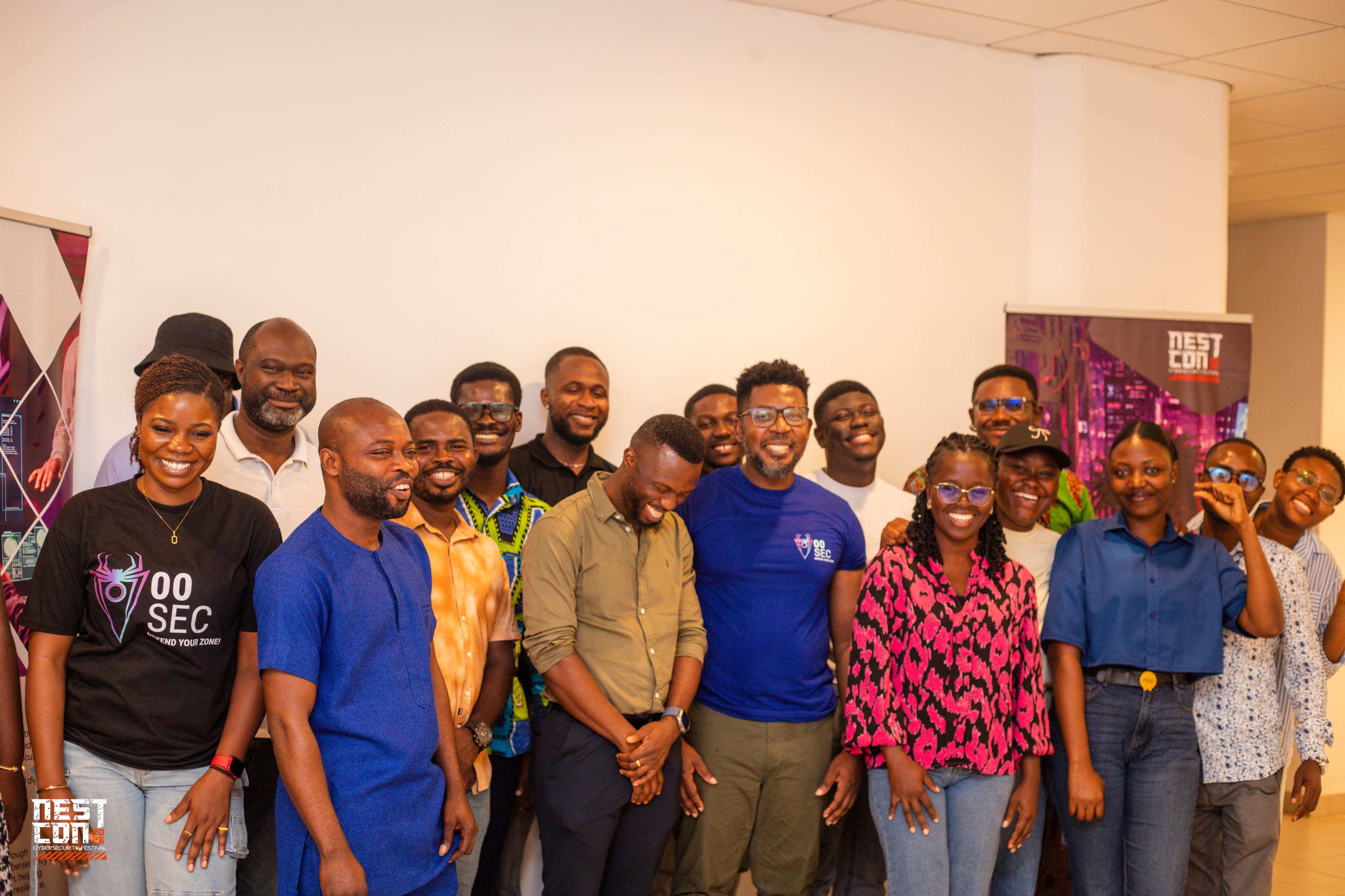 A large group of NESTCON organisers, mentors and attendees posing together, smiling.