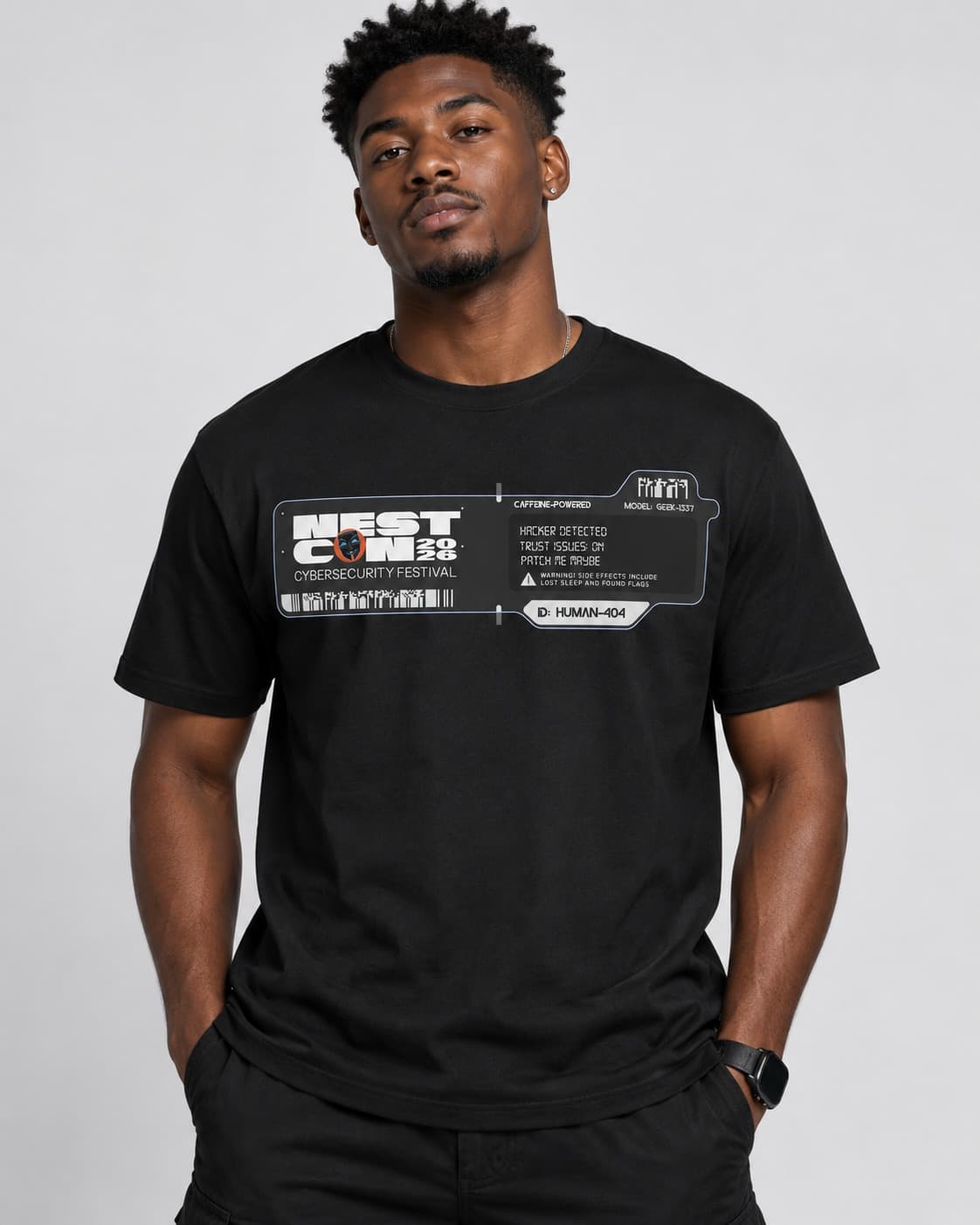 Black NESTCON 2026 cybersecurity festival T-shirt, shown worn with its printed design visible.