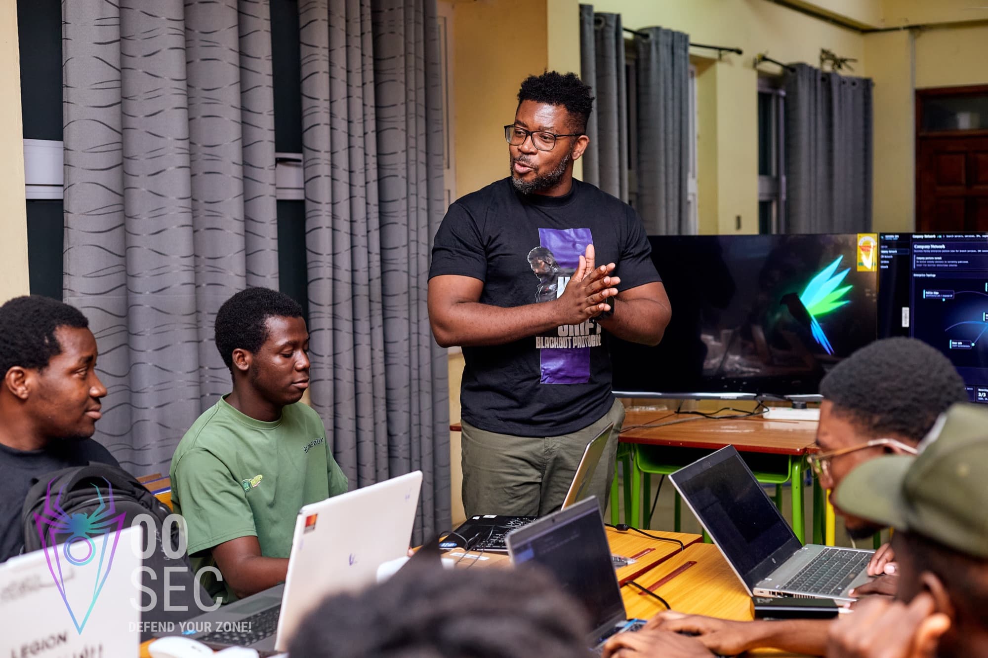 A 00Sec instructor walking participants through a hands-on lab during a NESTCON training session.